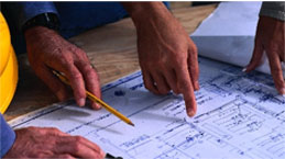 Hands pointing to blueprint on site survey